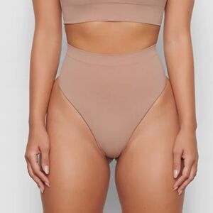SKIMS Seamless Sculpt Mid Waist Thong In Sienna Brown Shaping Shapewear